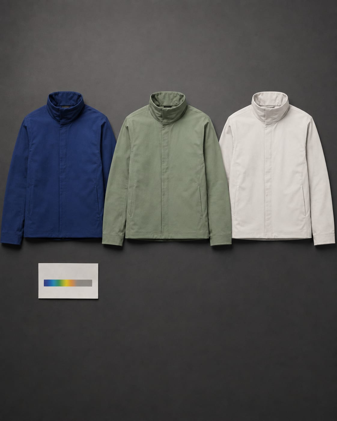 Three colorways flat: cobalt, spectral green and bone white, with a spectrum card