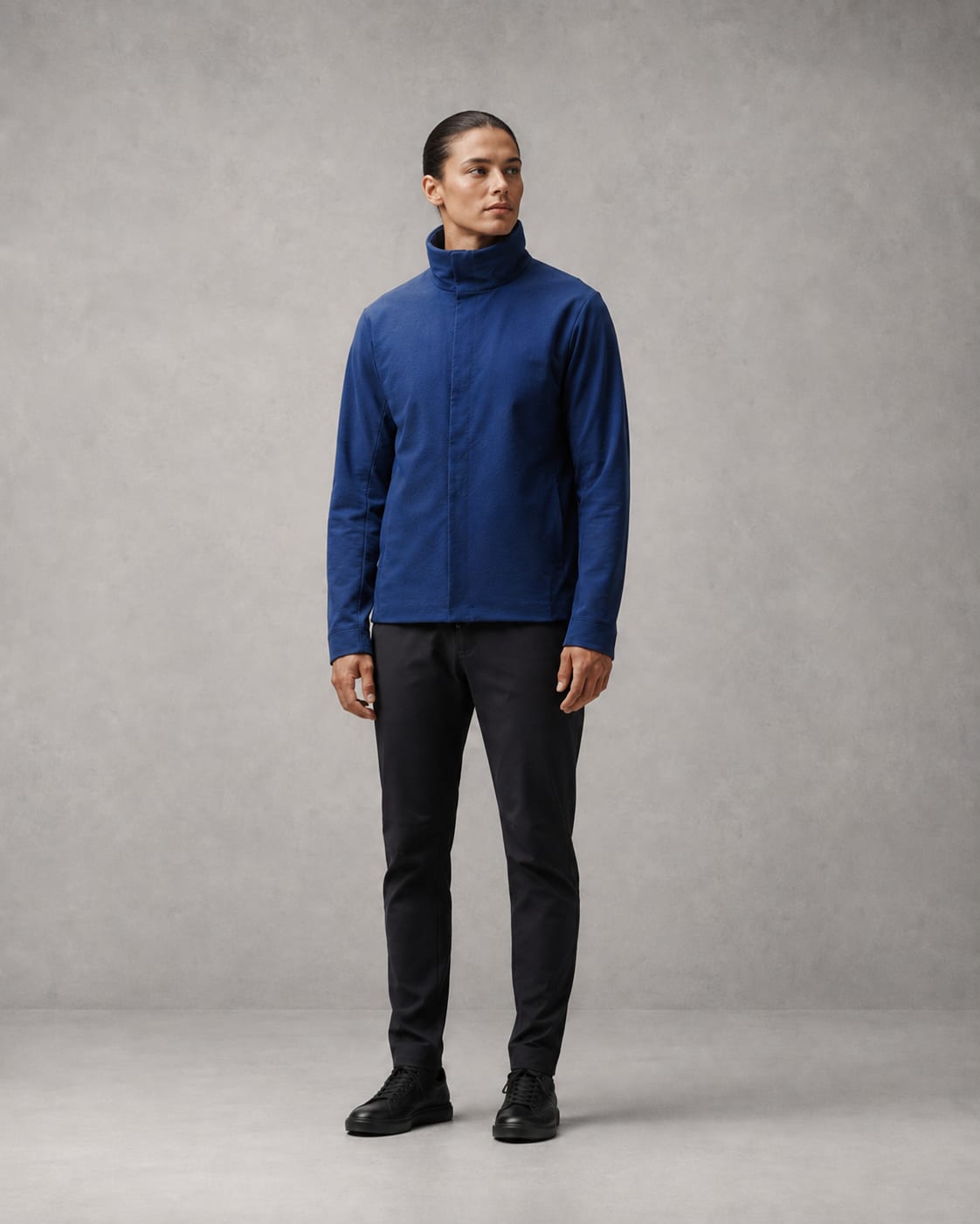 The Mosquito Jacket stowed: a normal looking cobalt jacket with a substantial stand collar