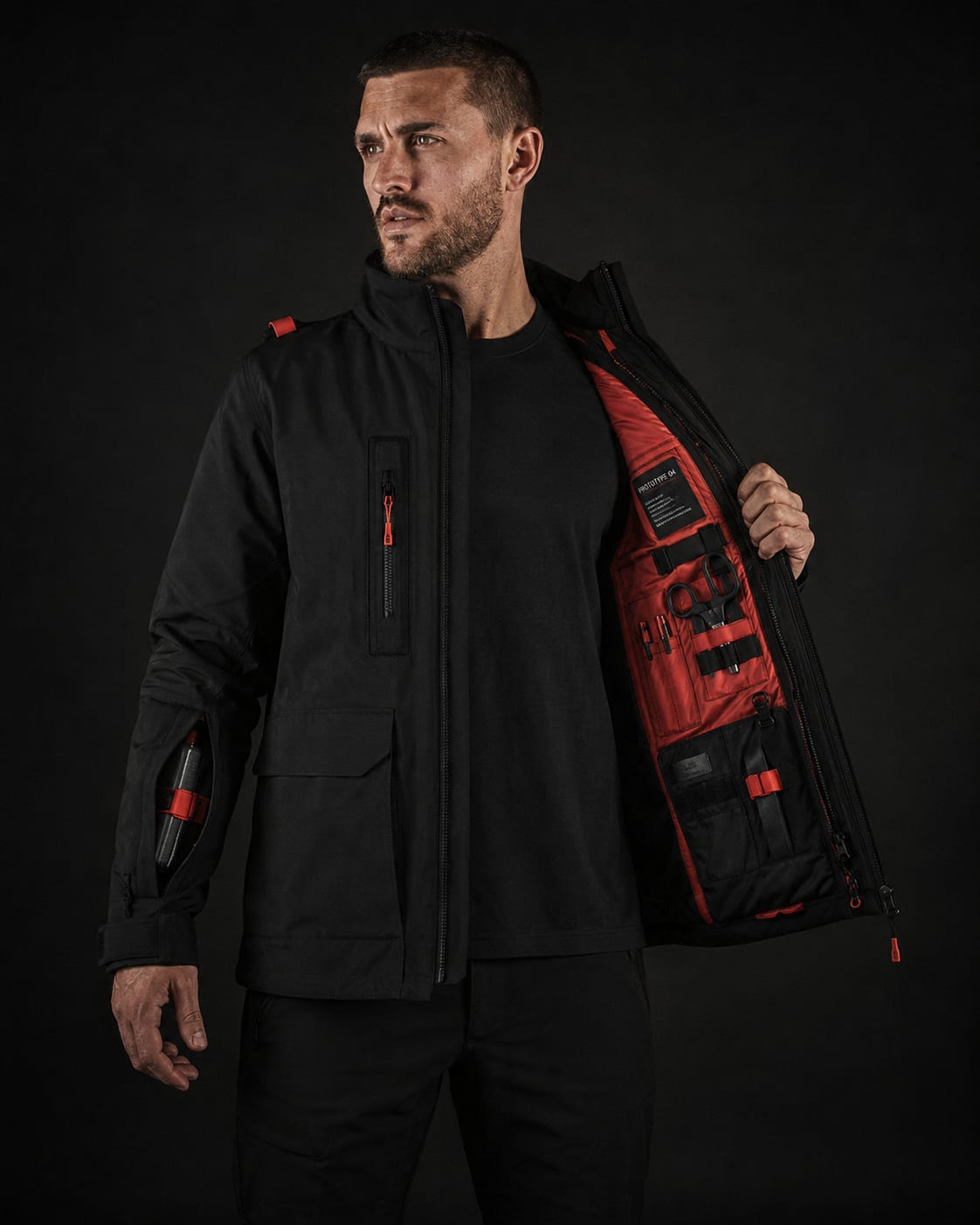The Trauma Jacket worn open, revealing a surgical red interior with medical modules